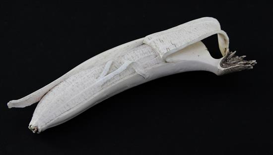 A Japanese ivory model of a partially peeled banana, early 20th century, 18.5cm. slight losses
